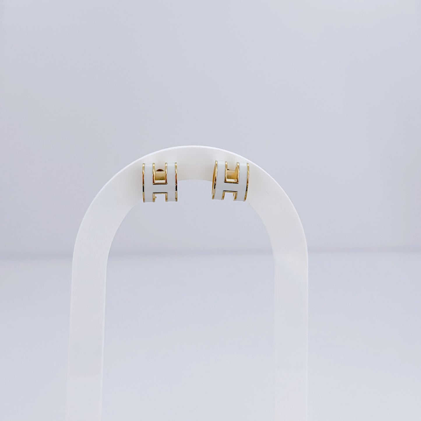 H white earring