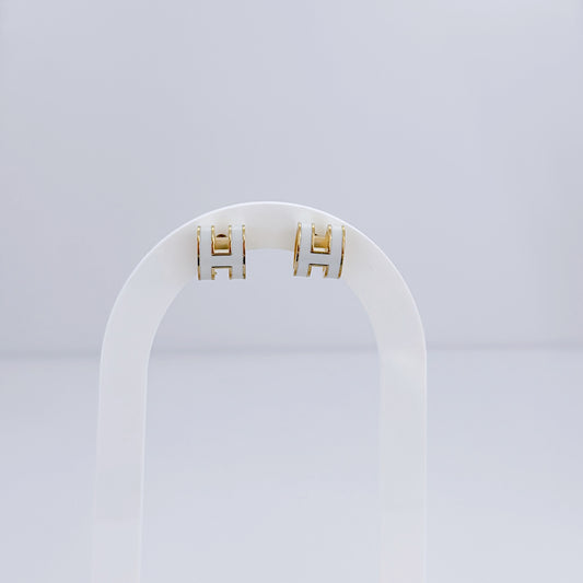 H white earring