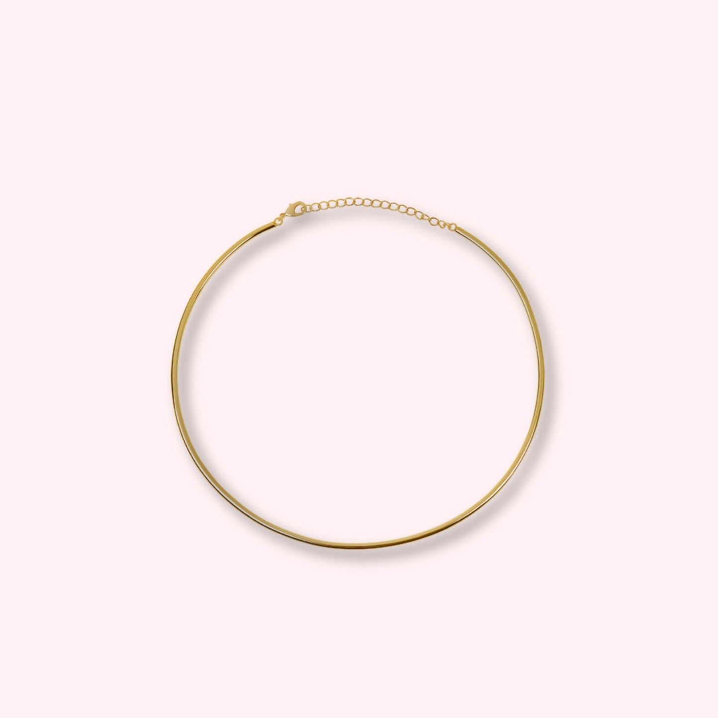 Hard gold choker β polished gold-tone rigid collar necklace, minimal and stackable.