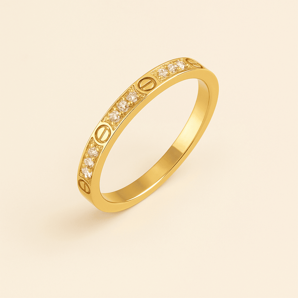 Elegant gold ring from MARO Jewelry Love Collection with diamond details on a luxury soft background.