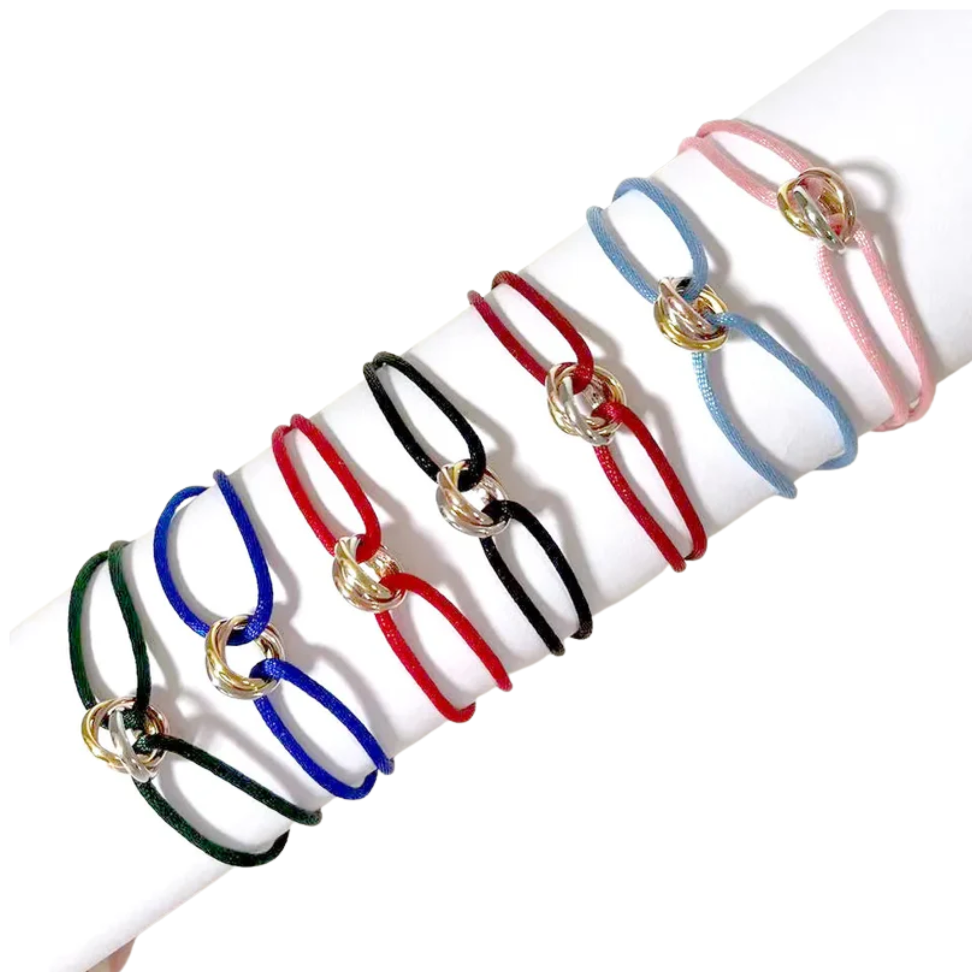 Set of adjustable friendship bracelets with multi-colored cords and a gold and silver interlocking ring charm. Perfect gift for friends.