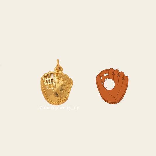 Gold baseball glove charm with textured details, displayed alongside an illustration of a brown baseball glove with a ball, on an off-white background, with a small brand watermark.