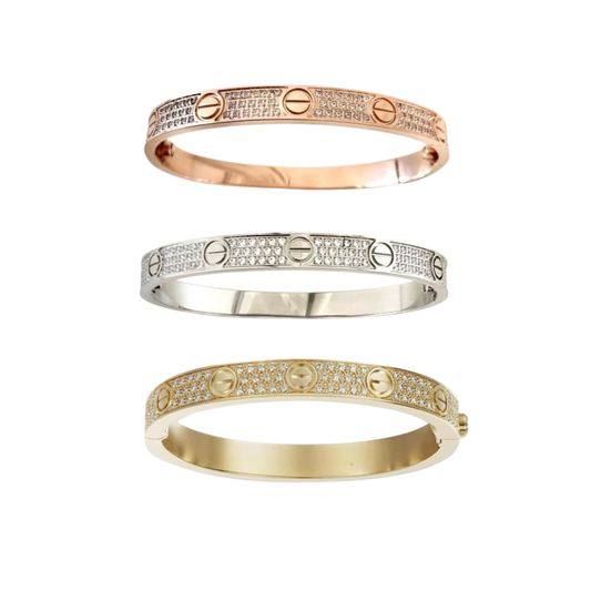 Set of three full pavé diamond simulated bangles in tricolor (rose gold, white gold/silver, gold). Luxury screw-style bracelets.