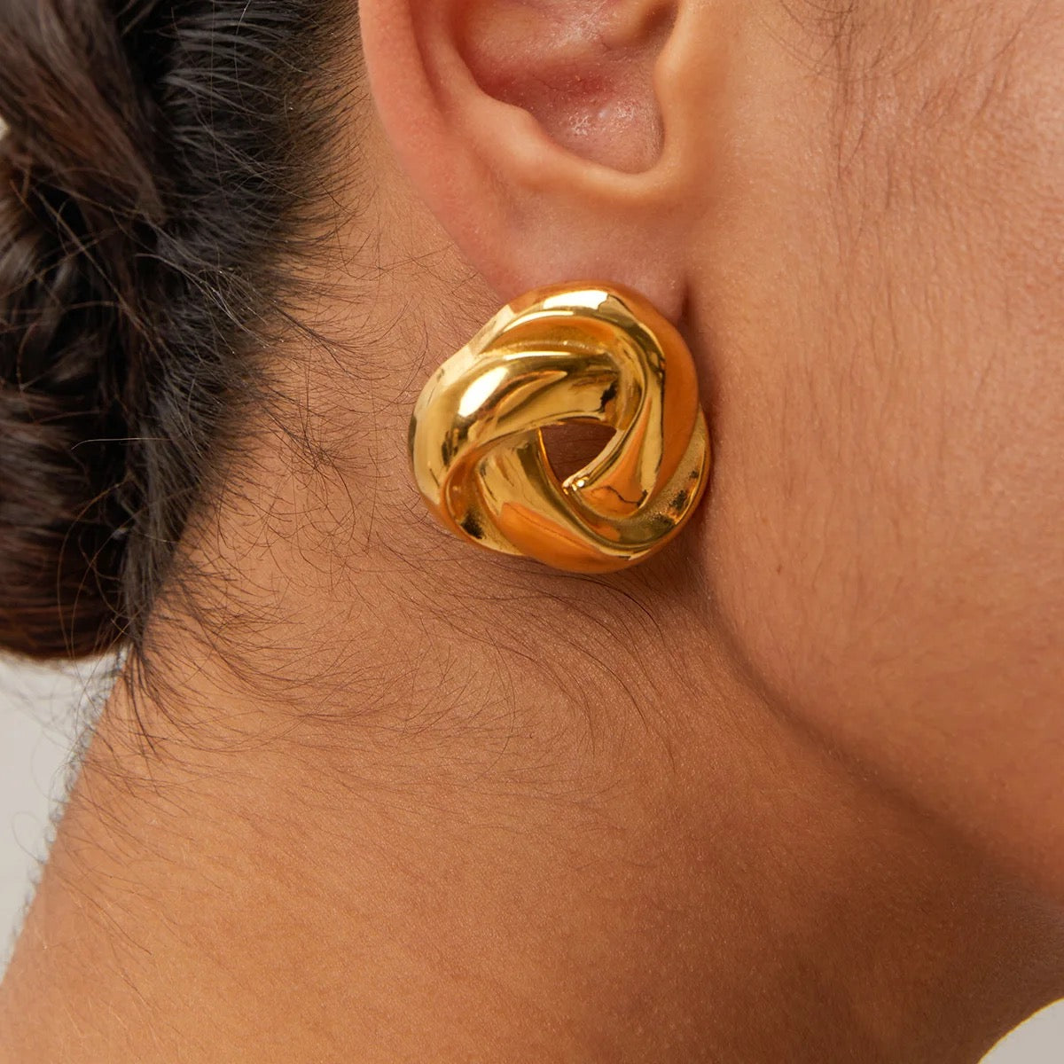 Knot Stud Earrings in gold — polished minimalist design symbolizing love and connection, waterproof and hypoallergenic jewelry by MARO.