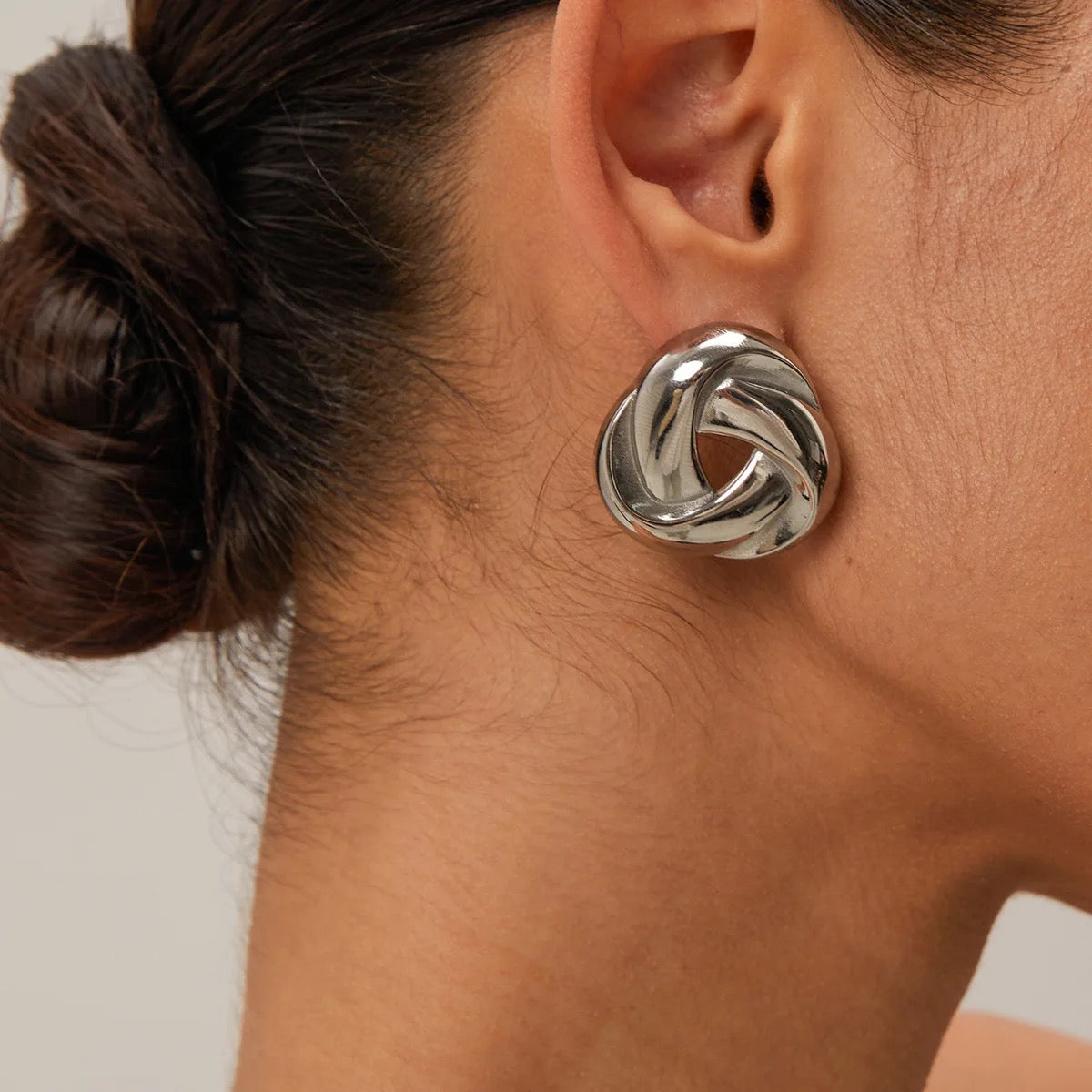 Knot Stud Earrings in silver — sleek polished design symbolizing love and unity, waterproof and hypoallergenic jewelry by MARO.